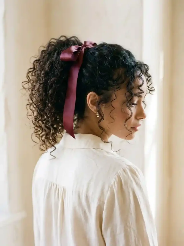 Curly Ponytail With a Ribbon